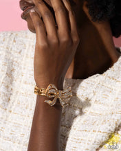 Load image into Gallery viewer, Paparazzi Its All A-BOW-t Me - Gold
